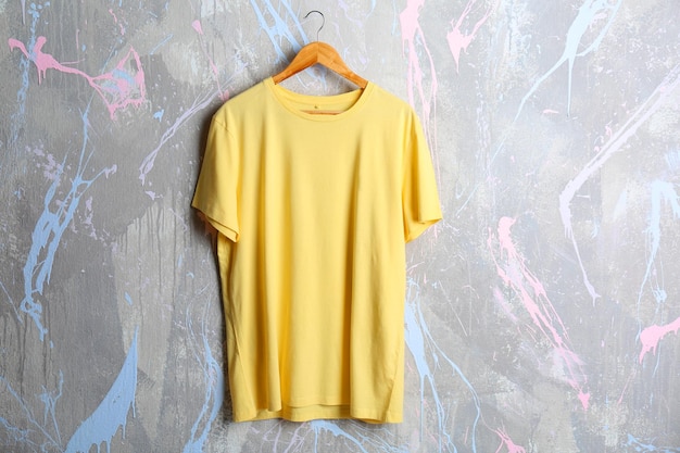 blank yellow tshirt on grunge background