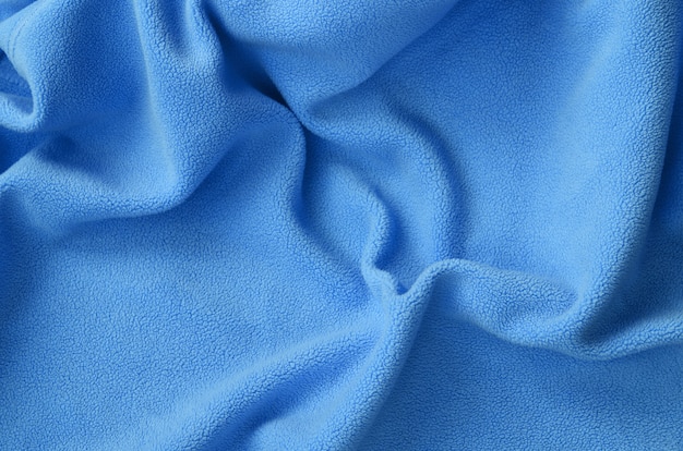 The blanket of furry blue fleece fabric. 