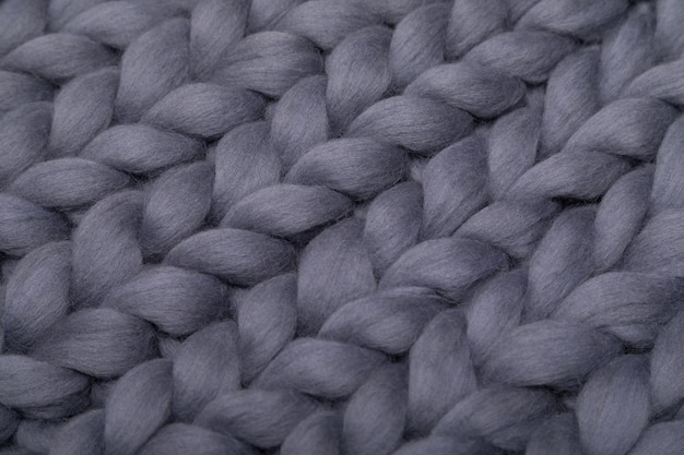 Blanket made of natural sheep wool closeup gray