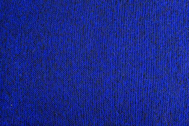 Blauw en zwart gemêleerde gebreide textuur en platte achtergrond