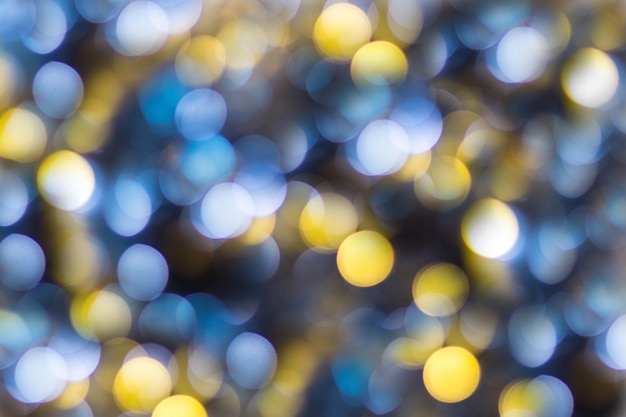 Blauw Geel Wit bokeh. Kerstmis achtergrondstructuur.