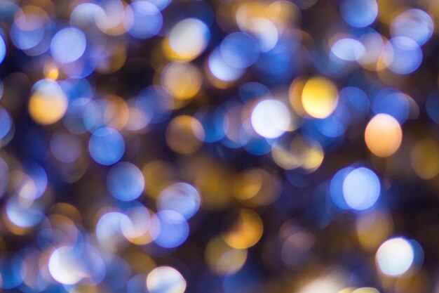 Blauw Geel Wit bokeh. Kerstmis achtergrondstructuur.