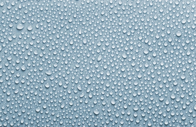 Blauw gekleurde regendruppels achtergrond en textuur