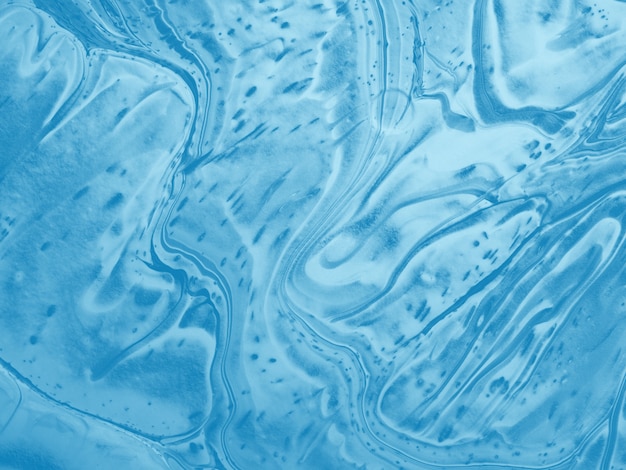 Blauwe abstracte achtergrond gemaakt met vloeiende kunsttechniek