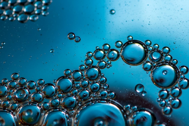 Blauwe achtergrond. abstracte macrofotografie. olie bubbels. watertextuur.