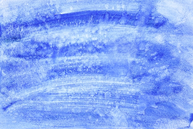 Blauwe aquarel penseelstreken - abstracte achtergrond