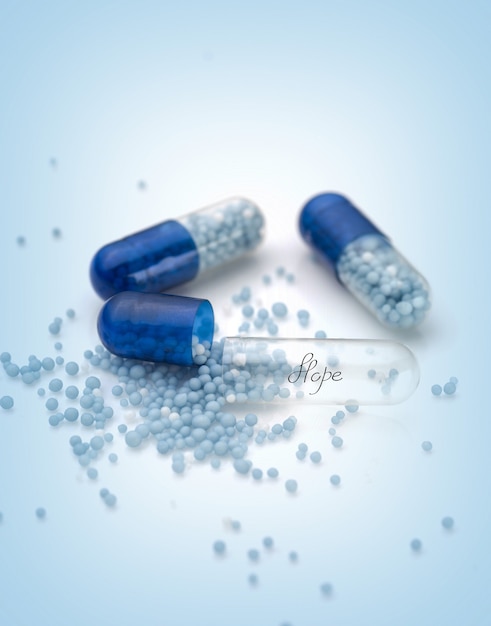 Blauwe capsules en pillenachtergrond