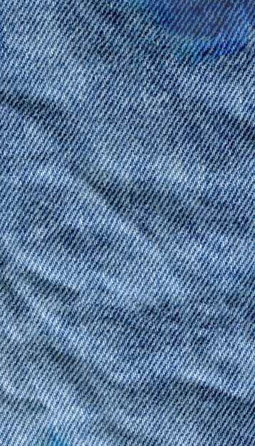 Blauwe de textuurachtergrond van denimjean