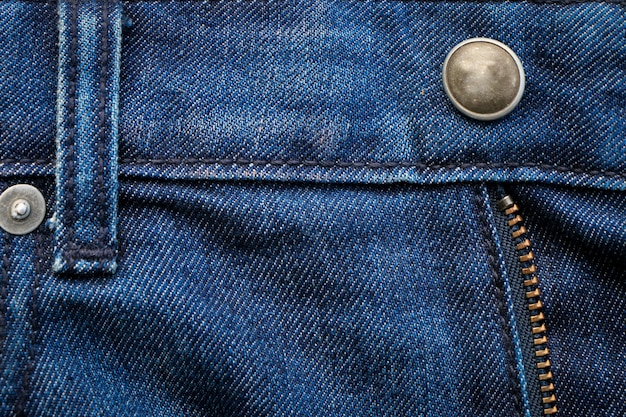 Blauwe de textuurachtergrond van denimjeans