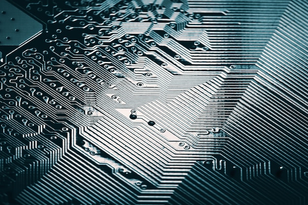 Foto blauwe elektronische moederbord circuit close-up macro achtergrond.
