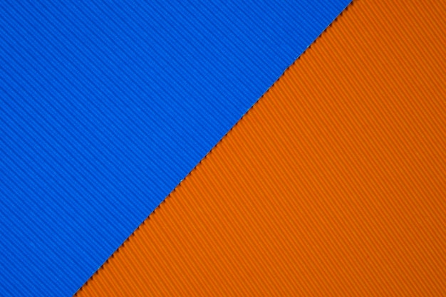 Blauwe en oranje golfdocument textuurachtergrond.