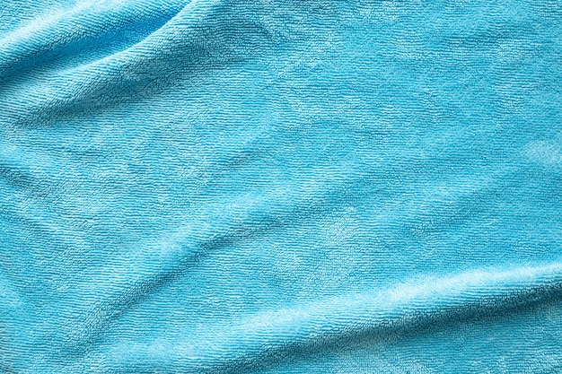 Blauwe handdoek stof textuur oppervlak close-up achtergrond