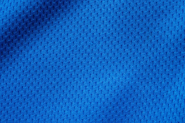 Blauwe sportkleding stof voetbalshirt jersey textuur close-up