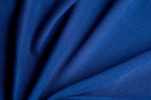 Foto blauwe stof textuur achtergrond, abstract, close-up textuur van doek