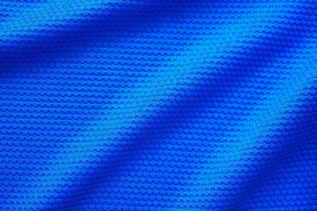 Blauwe voetbal trui kleding stof textuur sport slijtage achtergrond close-up bovenaanzicht