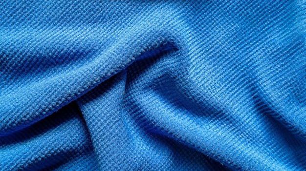 Blauwe zijden stof achtergrond Abstracte golvende textuur Blauwe stof doek polyester textuur en textiel