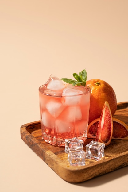 Blend of cocktails in glasses with ice cubes and blood orange