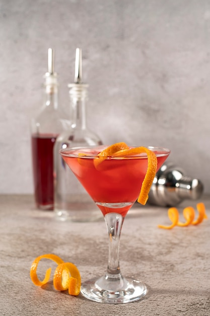 Blend of cocktails in glasses with ice cubes and orange peel