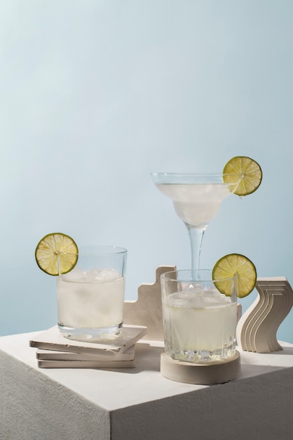 Photo blend of cocktails in glasses with lime slices