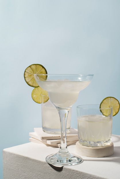 Photo blend of cocktails in glasses with lime slices