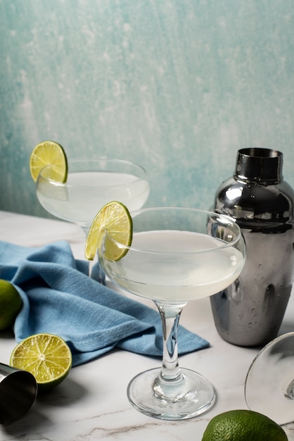 Blend of cocktails in glasses with limes
