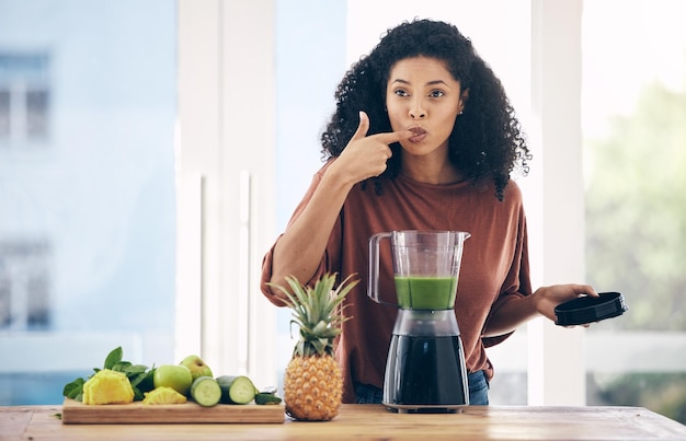 Blender smoothie and healthy black woman taste juice for green diet detox and breakfast fruits in kitchen Vegetables food and person or nutritionist with natural protein shake or vegan drink