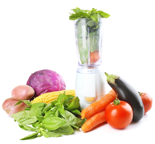 Blender with fresh vegetables isolated on white