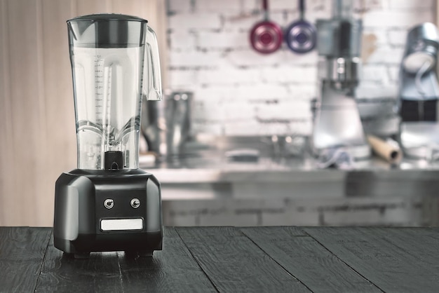 Blender and wooden table in kitchen. Do Smoothies