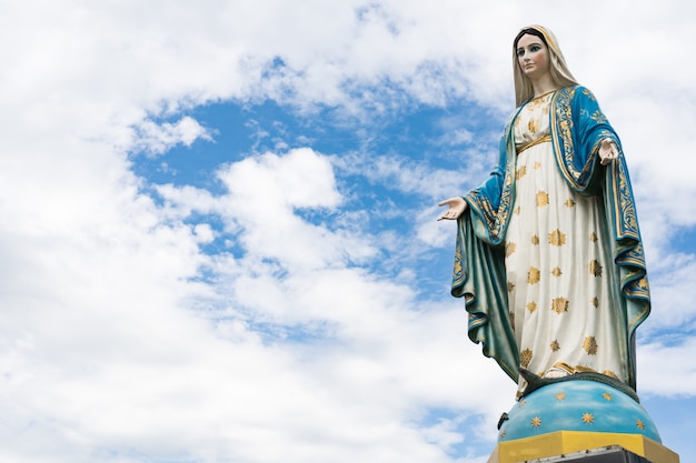 The Blessed Virgin Mary,mother of Jesus on the blue sky, in front of the Roman Catholic Diocese,