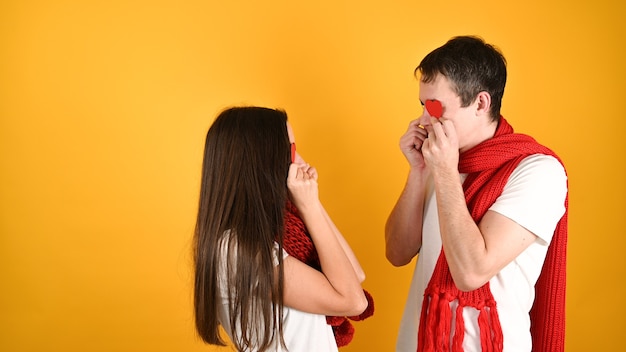 Blinded by love couple on yellow