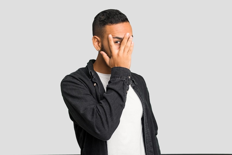 Photo blink through fingers frightened and nervous