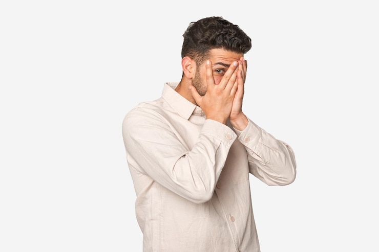 Photo blink through fingers frightened and nervous