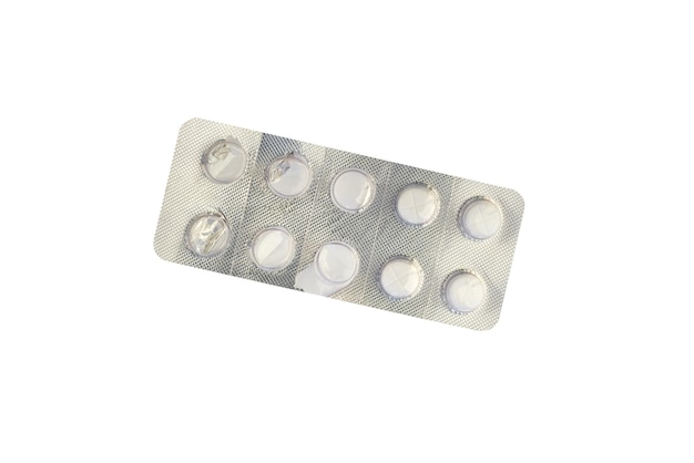 Foto blister con pillole luminose isolate su bianco vista dall'alto