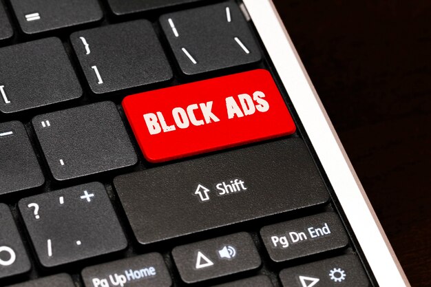 Block ads on Red Enter Button on black keyboard.