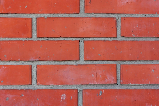 Blocks of bright orange brickwall, space for text