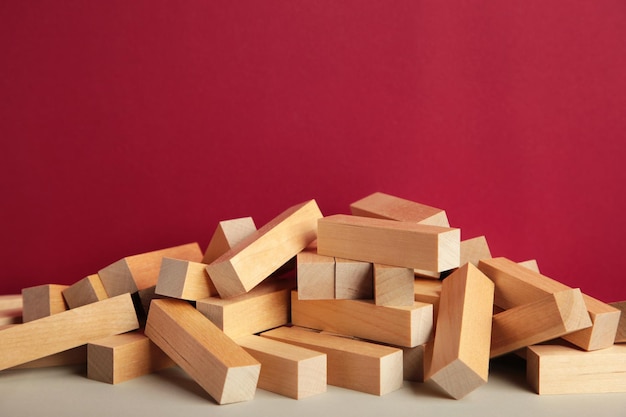 Blocks of wood on red background Strategy game as a business plan for team work