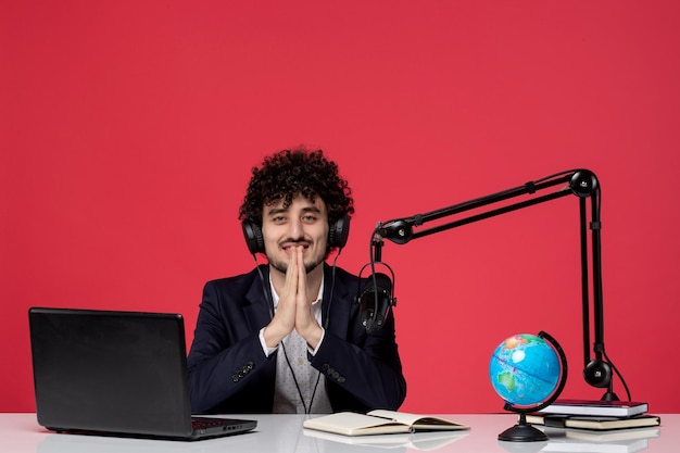 Blogger journalist brunette cute handsome young guy in black blazer recording speech