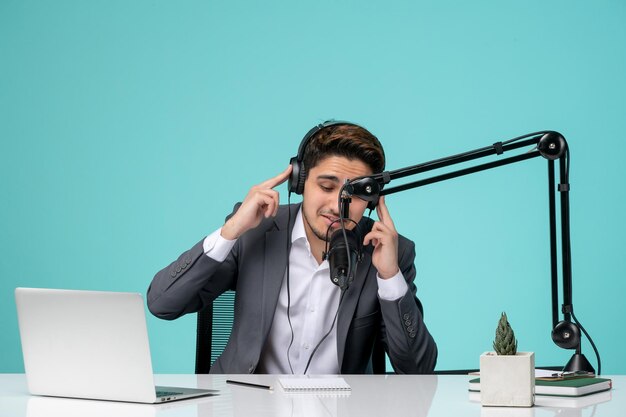 Blogger journalist recording speech cute handsome guy in office listening carefully