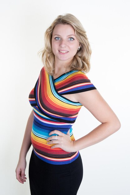 Blond and beautiful woman with colored dress