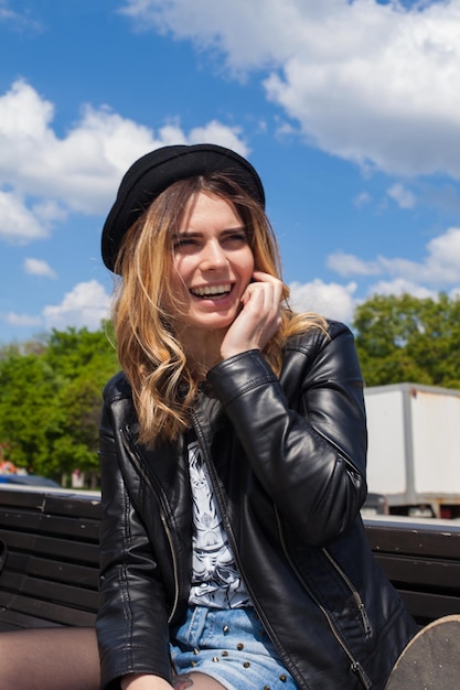 Blond girl talking on the phone with her mouth open