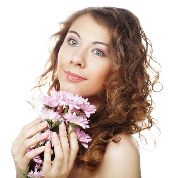 Photo blond girl with pink flowers