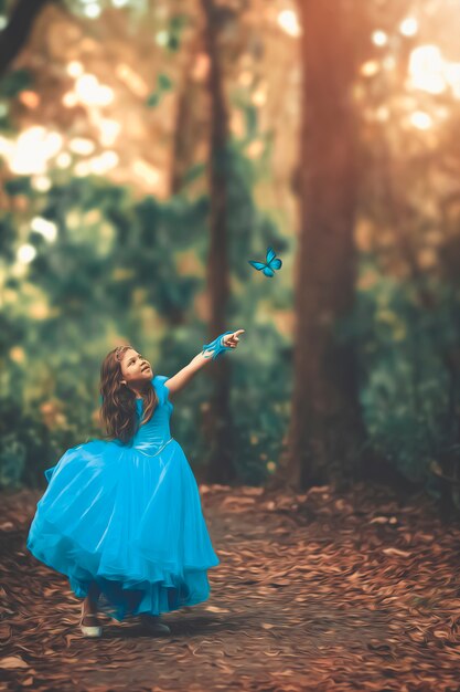 Blond hair girl in a blue retro dress. Princess from a fairy tale.