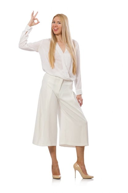 Blond hair model in elegant flared pants isolated on white