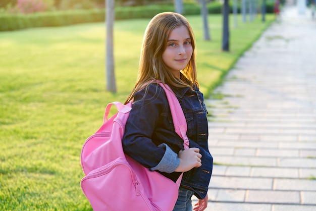 Blond kid student girl in the park