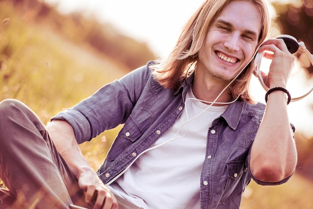 Blond man listening to music