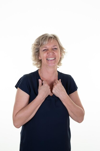 Blond mature woman hands palm holding blouse collar black shirt on white background