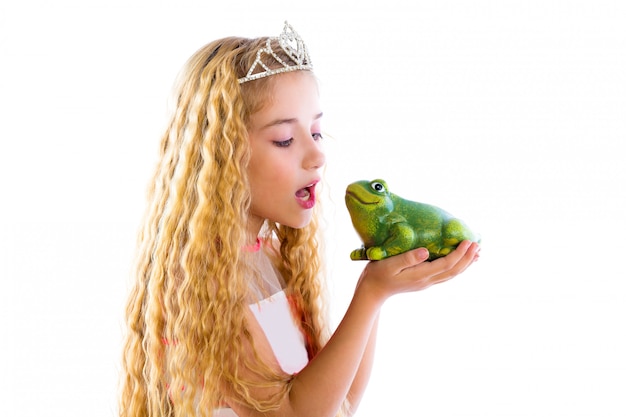 Blond princess girl kissing a frog green toad