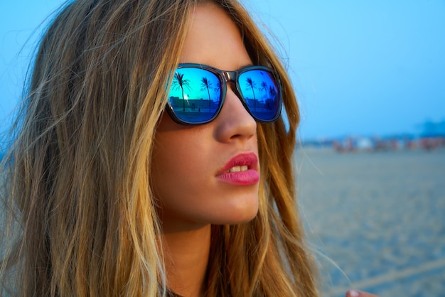 Blond teen girl sunglasses palm tree sunset