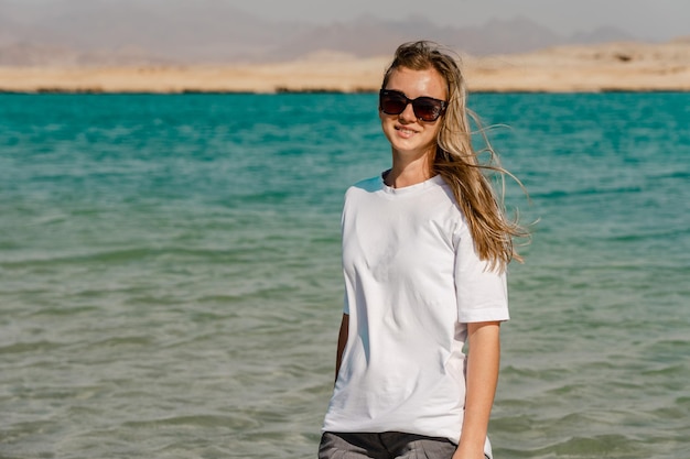 Blond woman on clear lake in desert of Ras Mohammed Egypt