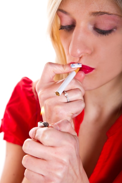 blond woman smoking a cigarette